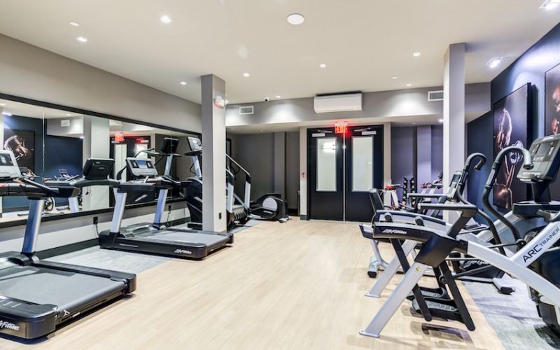fitness center with cardio equipment and outdoor spin bikes 