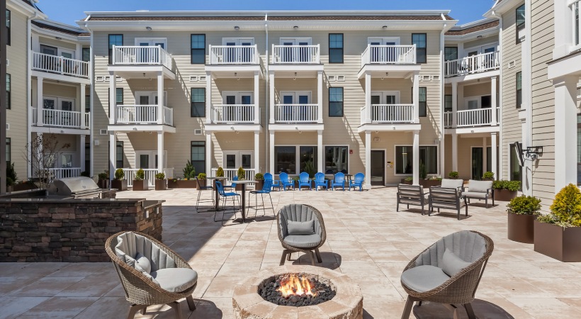 Cornerstone Courtyard courtyard area with firepit, seating and bbq grills